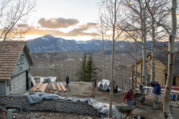 A construction crew works at a home in Mount Crested Butte, Colorado. Construction costs have soared across the country in the past few years and are especially high in mountain ski towns.